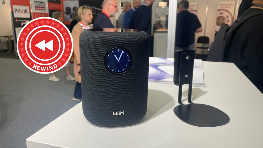 WiiM Sound on table with Rewind Logo