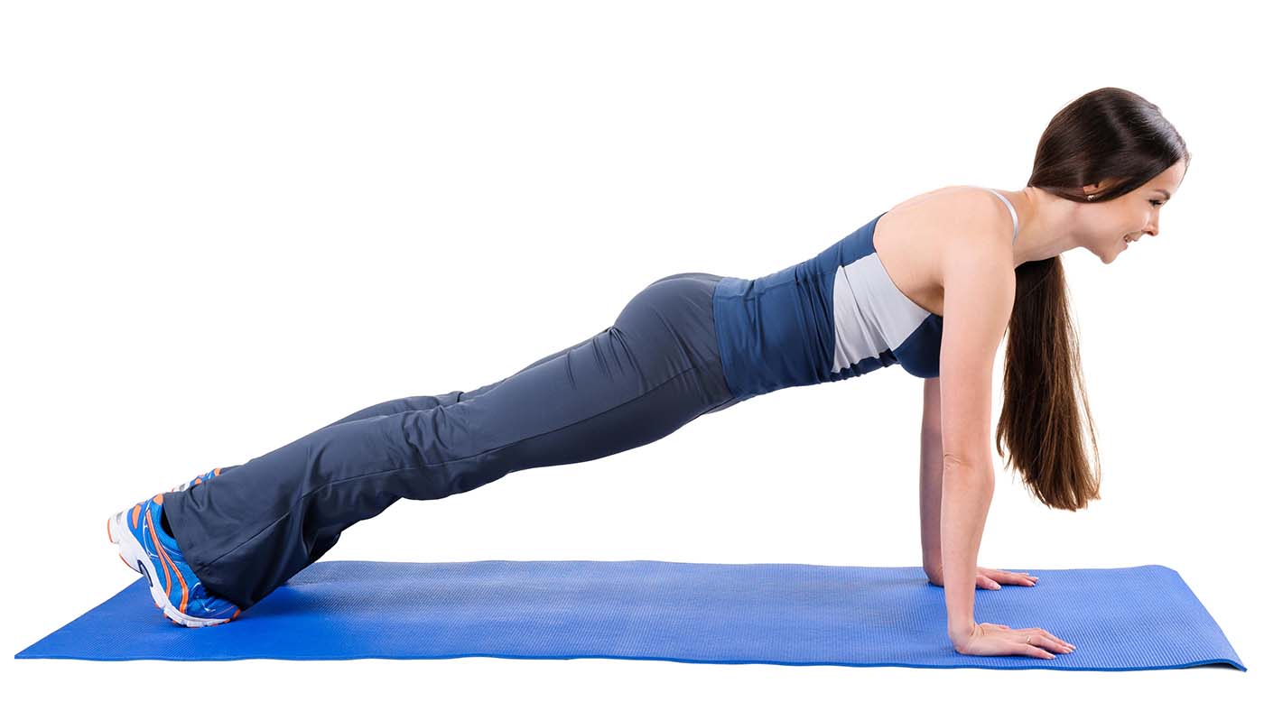 F7090W Young woman doing Straight Arms Plank Workout