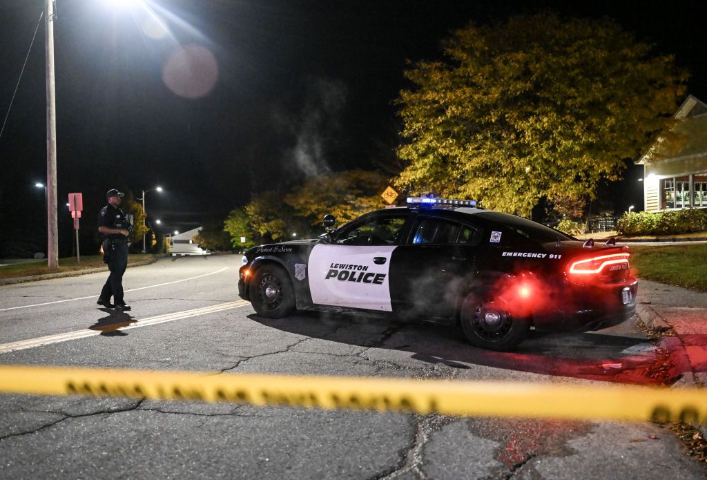 Police officers close the road as they patrol around the street during inspection after a gunman&#039;s multiple shootings in Maine