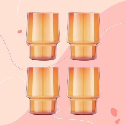 Stackable tumbler glasses against pink background