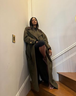 Influencer wears an olive winter outfit