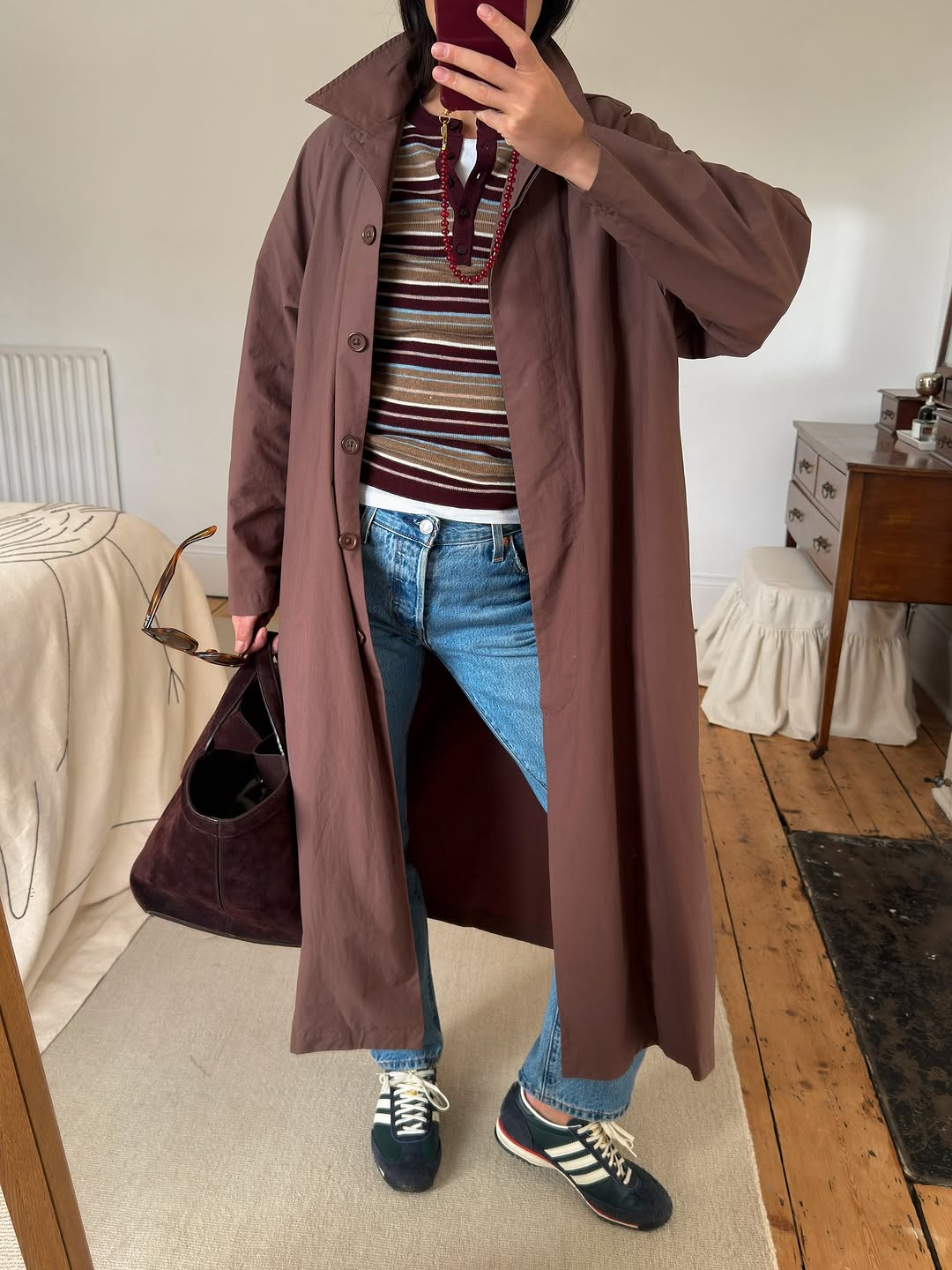 Woman wearing layering outfit idea 2026.