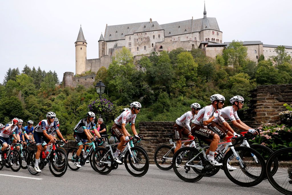 LUXEMBOURG LUXEMBOURG SEPTEMBER 14 LR Benoit Cosnefroy of France Andrea Vendrame of Italy and AG2R Citren Team and The Peloton passing in front of the Vianden Castle in Luxembourg City during the 81st SkodaTour De Luxembourg 2021 Stage 1 a 140km stage from Luxembourg to LuxembourgKirchberg 352m skodatour skodatour on September 14 2021 in Luxembourg Luxembourg Photo by Bas CzerwinskiGetty Images