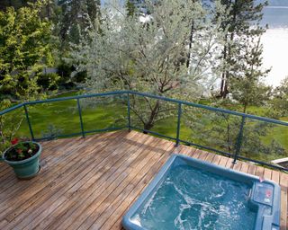 hot tub with glass fence