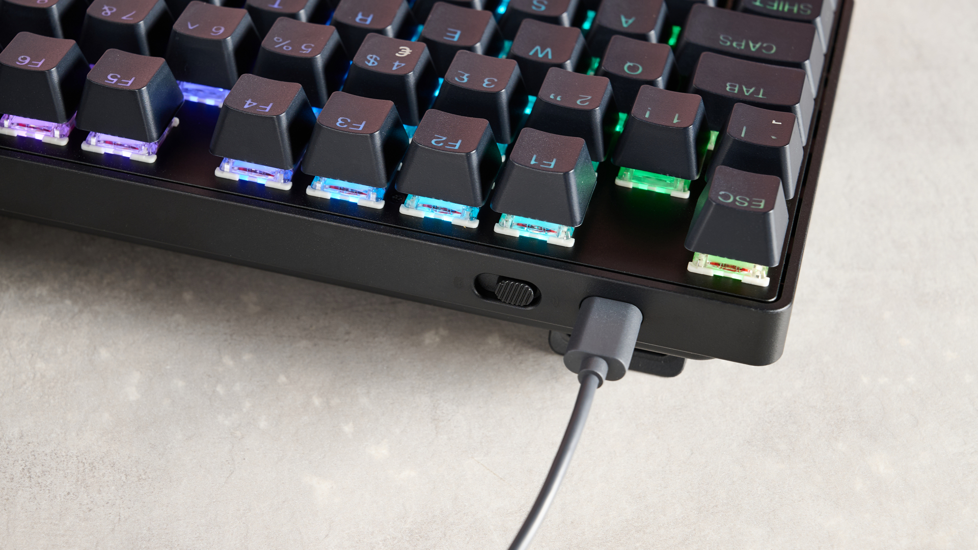 Close-up of power button and USB-C cable on SteelSeries Apex Pro TKL Wireless Gen 3