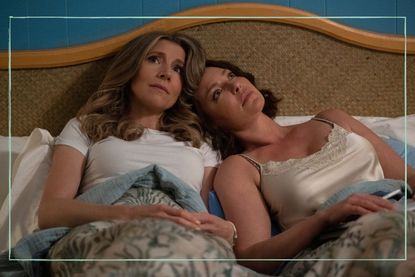a close up of Katherine Heigl and Sarah Chalke in bed in a still from Firefly Lane season 2