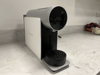 A white Morning coffee maker sitting on a kitchen countertop