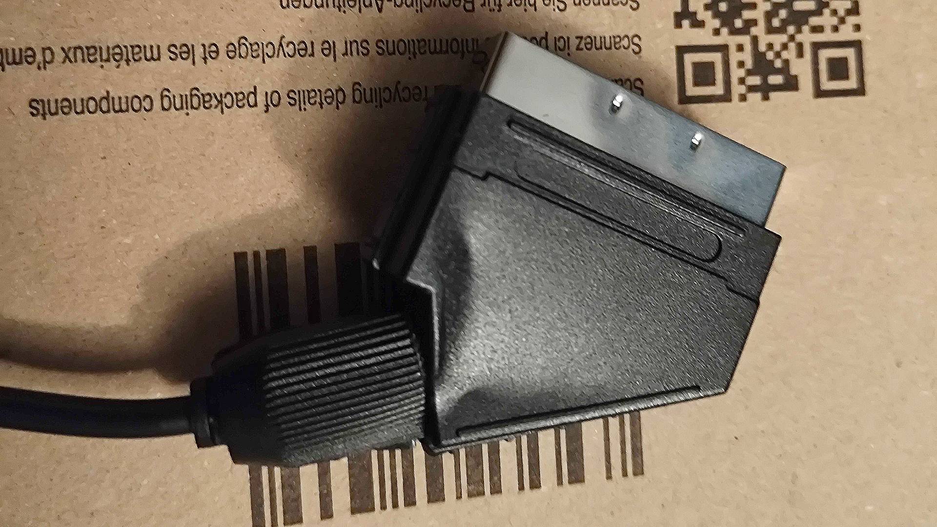 Close up of SCART cable with flimsy plastic that is bent in.