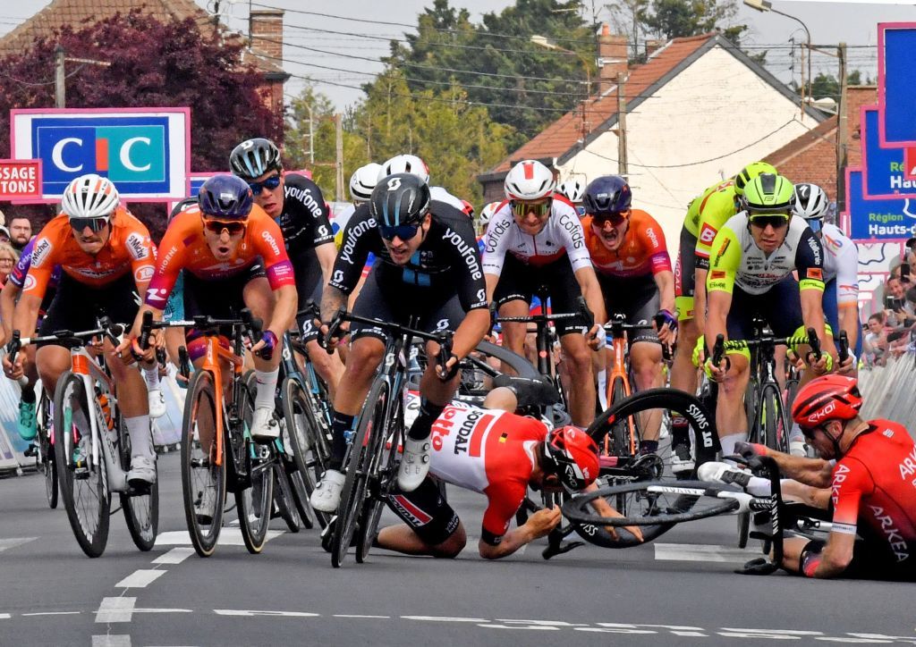 Team DSMs Australian Sam Welsford C sprints next to Human Powered Healths Dutch Arvid de Kleijn 2L as Lotto Soudals Belgian Arnaud De Lie 2ndR and Arkea Samsics British Daniel McLay R crash during the 161 km between Dunkirk and Aniche first stage of the 4 jours de Dunkerque Four days of Dunkirk cycling race in Aniche northern France on May 3 2022 Dutch rider Arvid de Kleijn Human Powered Health was declared winner of the first stage of the Four Days of Dunkerque on May 3 2022 in Aniche after Australian rider Sam Welsford was dropped Welsford Team DSM was the first to cross the line but was considered responsible for the crash that sent Arnaud De Lie Lotto Soudal and Daniel McLay Arkea Samsic to the ground Photo by FRANCOIS LO PRESTI AFP Photo by FRANCOIS LO PRESTIAFP via Getty Images