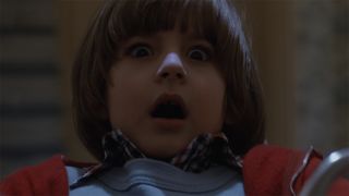 Danny Lloyd as Danny Torrance looking terrified in The Shining