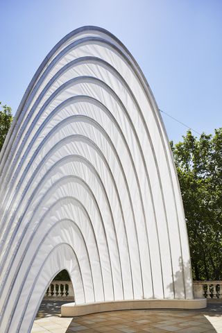 The sail-shaped white structure of Ini Archibong's Pavilion of the African Diaspora