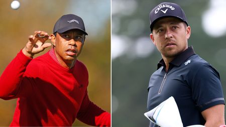 Tiger Woods catches a golf ball, whilst Xander Schauffele stares into the distance