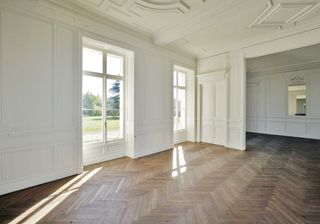 interior of house with white wall and wooden floor