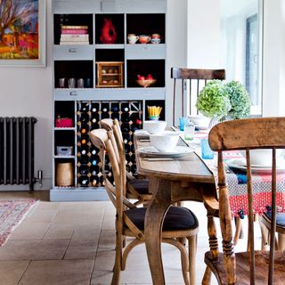 Kitchen with wine racks and a wooden kitchen table