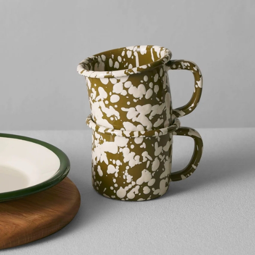 Image of two green and white splatter print mugs