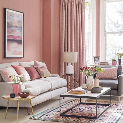 pink living room with sofa and table