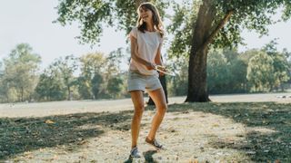 Woman playing frisbee in the park