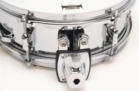 The 12"x4" steel is fitted with a tom-arm clamp.