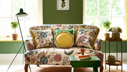 Faded floral printed sofa by Linwood