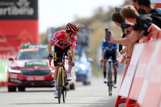 VELEFIQUE SPAIN AUGUST 22 Primoz Roglic of Slovenia and Team Jumbo Visma crosses the finishing line in second place ahead of Enric Mas Nicolau of Spain and Movistar Team during the 76th Tour of Spain 2021 Stage 9 a 188 km stage from Puerto Lumbreras to Alto de Velefique 1800m lavuelta LaVuelta21 on August 22 2021 in Velefique Spain Photo by Stuart FranklinGetty Images