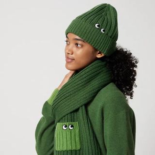 green hat scarf and sweater with embroidered eye design