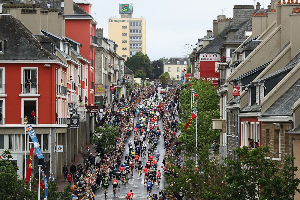 The peloton roll out of Saint-Lo at the start of stage two of the 2016 Tour de France