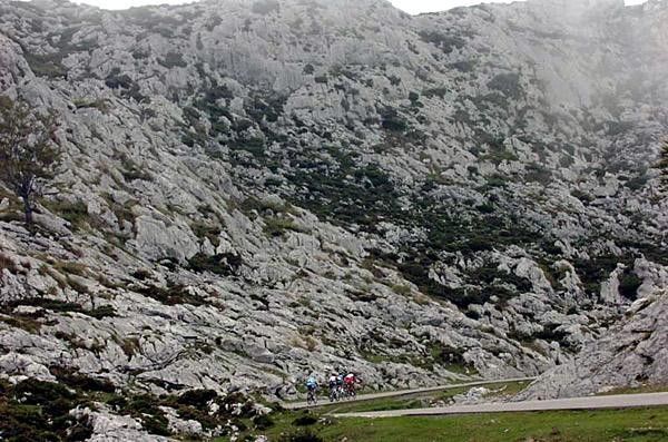 Riders a mere specks in the vast rocky landscape