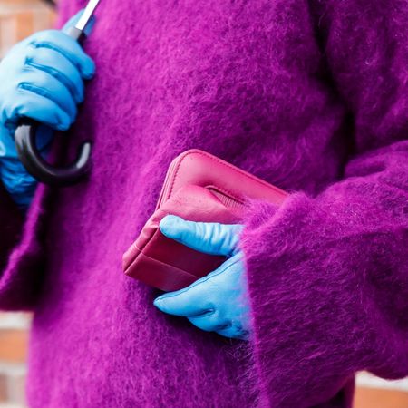 COPENHAGEN, DENMARK - FEBRUARY 01: Influencer Grece Ghanem wearing a purple turtleneck pullover by Gestuz, light blue leather gloves by Gestuz, a pink clutch by Gestuz, is seen at the GESTUZ fashion show on February 1, 2022 in Copenhagen, Denmark. (Photo by Streetstyleshooters/Getty Images)