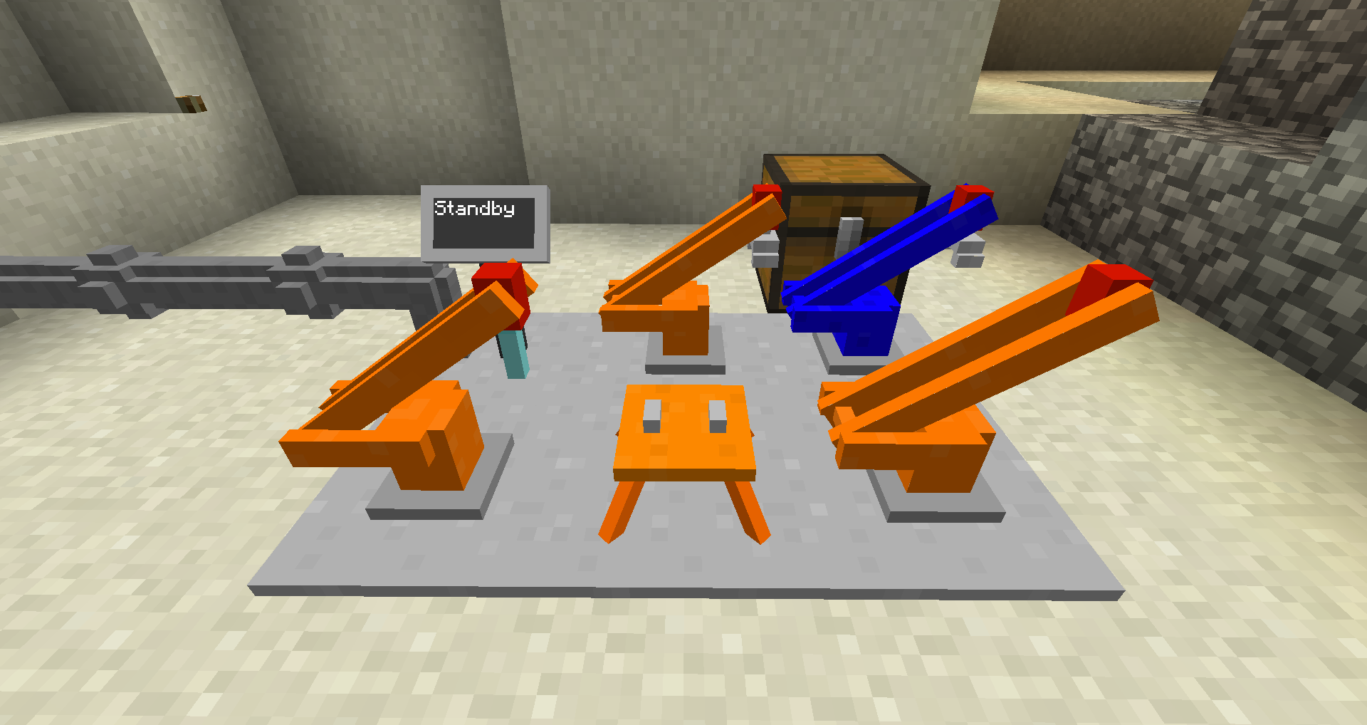 Minecraft mods - Pneumatic craft - Orange and blue arm devices near a wood chest