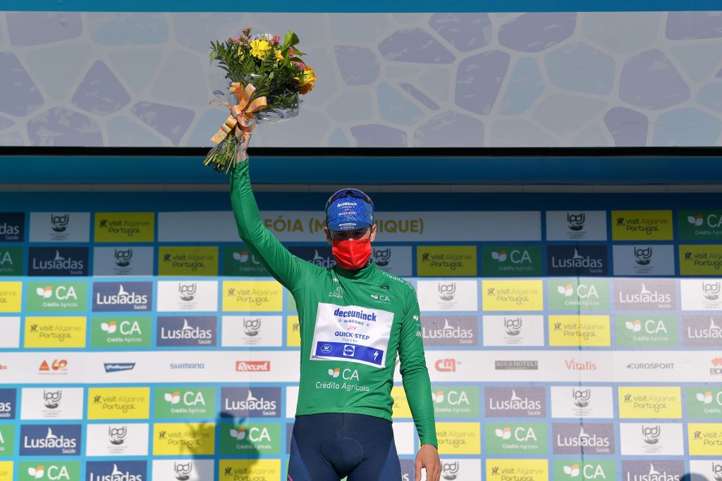 FOIA PORTUGAL MAY 06 Sam Bennett of Ireland and Team Deceuninck QuickStep Green Points Jersey celebrates at podium during the 47th Volta Ao Algarve 2021 Stage 2 a 1828km stage from Sagres to Fia 890m Mask Covid safety measures VoltAlgarve VAlgarve2021 on May 06 2021 in Fia Portugal Photo by Luc ClaessenGetty Images