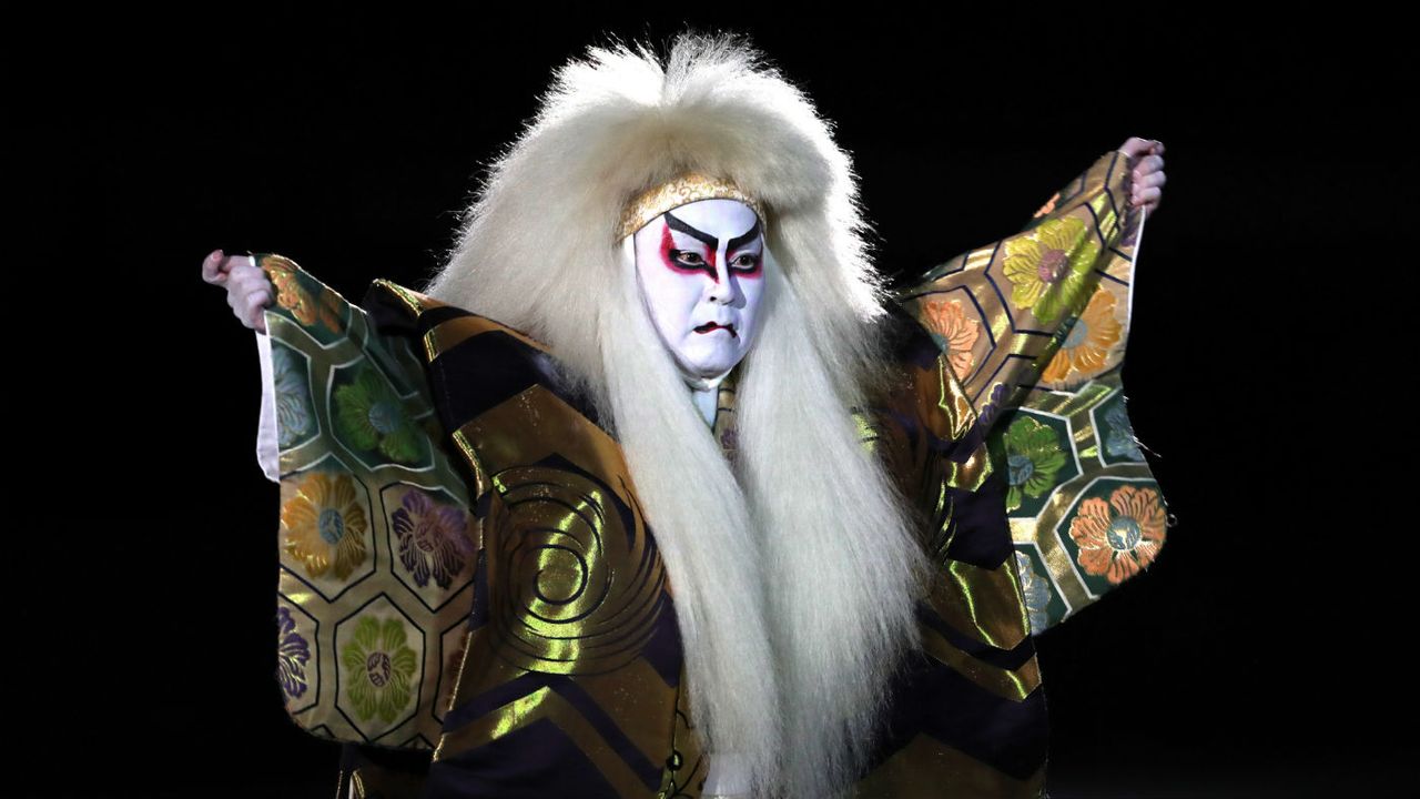 A Kabuki performer dances during the opening ceremony