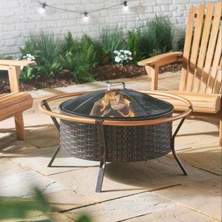 Copper Rim Fire Pit on wooden decking with chairs around