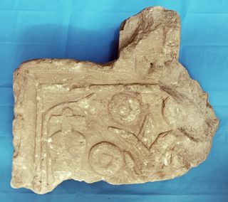 A broken offering table was among the finds.