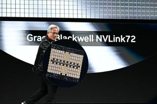 Nvidia CEO Jensen Huang holds a Grace Blackwell NVLink72 as he delivers a keynote address at the Consumer Electronics Show (CES) in Las Vegas, Nevada on January 6, 2025