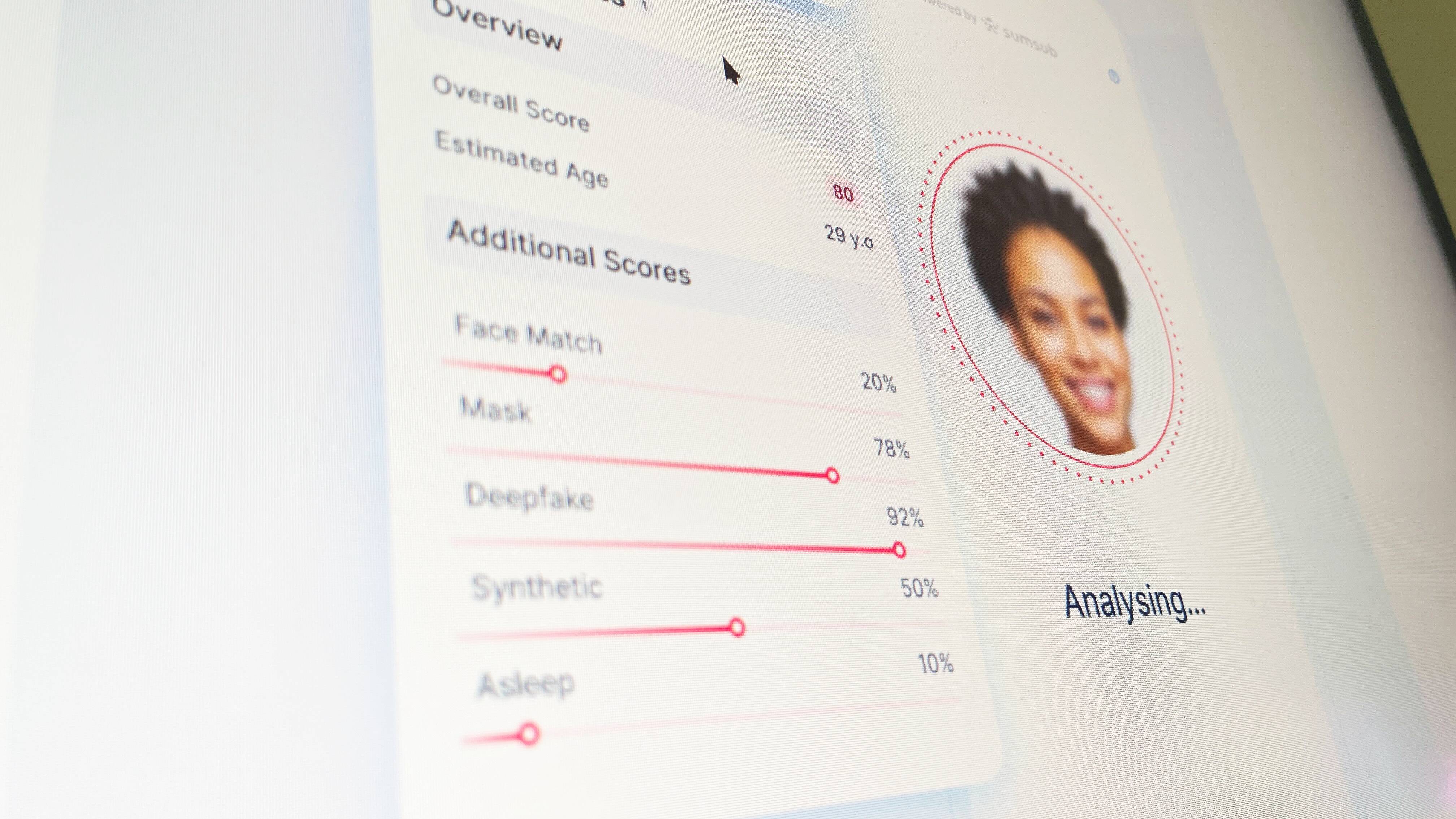 A screen showing Sumsub's home page with face verification analysis.