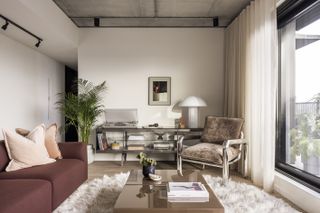 living space with armchairs and cream interiors at Vabel Lawrence Penthouse