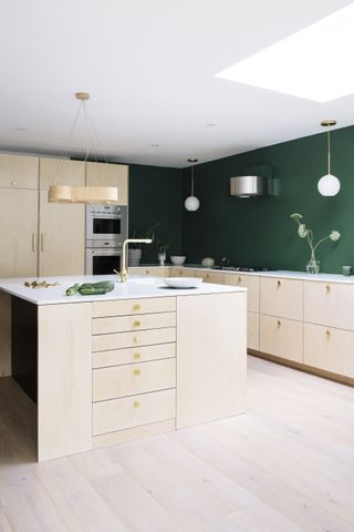 Kitchen island IKEA hacks with blond wood Scandi feel and green kitchen walls by Custom Fronts