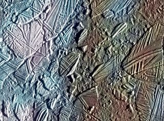 A close-up of Europa's surface reveals chaotic terrain with ridges, grooves and plains jumbled together across the icy moon's surface.