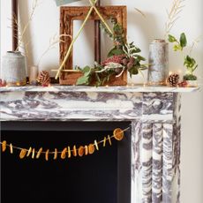 marble mantelpiece with dried orange slice decorations