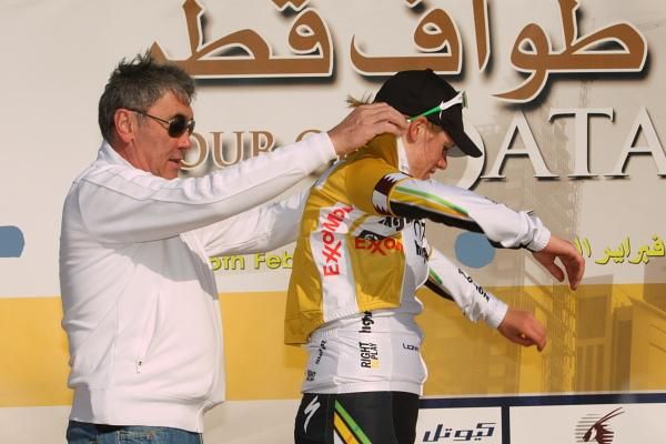A new race leader, Eddy Merkcx helps Ellen van Dijk (HTC-HighRoad) into the golden jersey