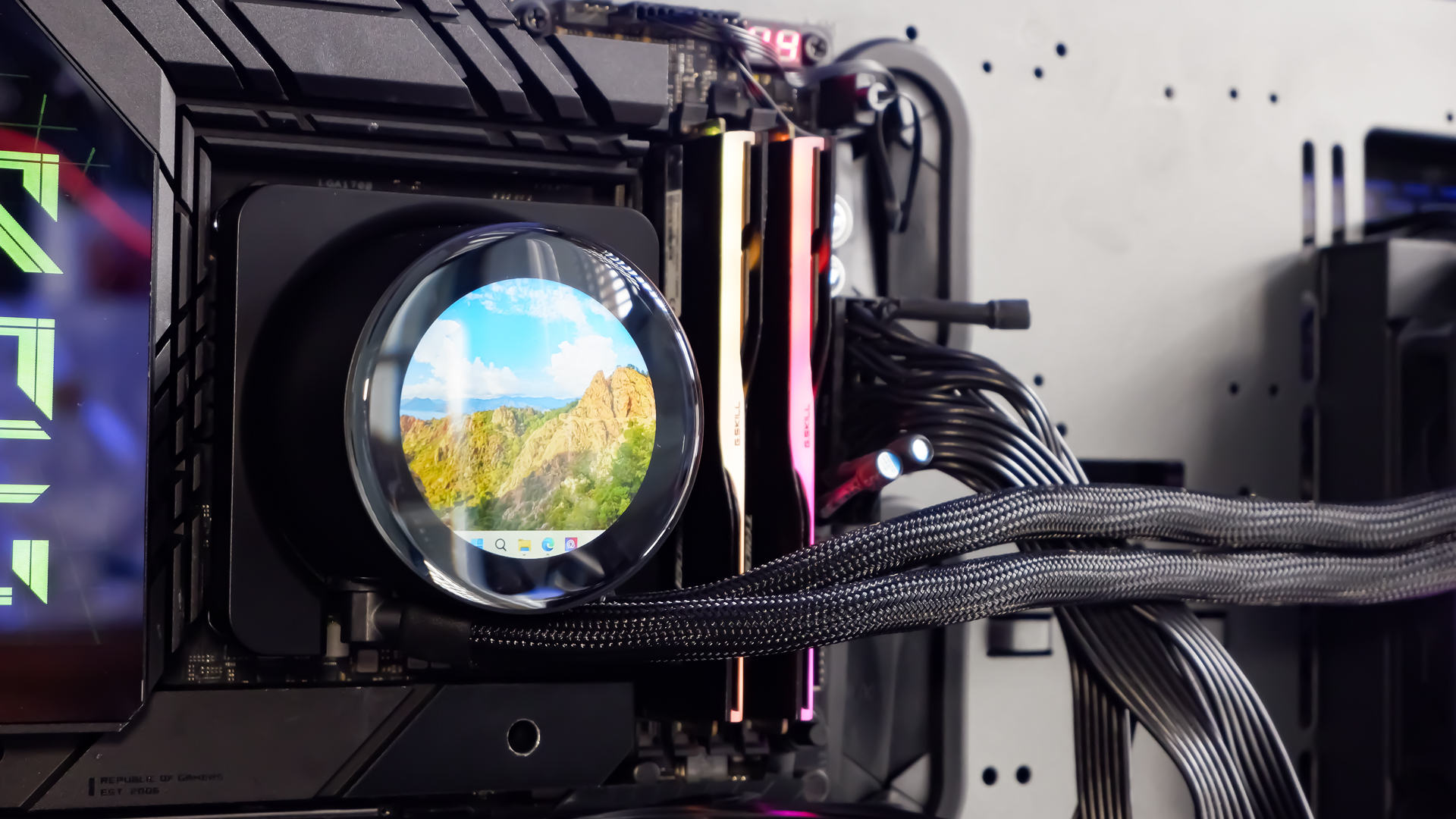 An MSI MPG CoreLiquid P13 all-in-one liquid cooler on a desk and installed onto a test bench for testing.
