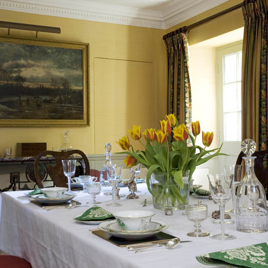 dining room with dining table with flower vase