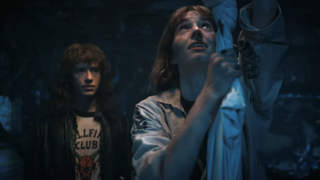 eddie and robin escape from the upside down in stranger things season 4