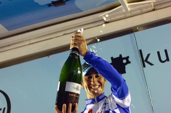 Carlos Barredo (Quick Step) lets the champagne fly on the podium.