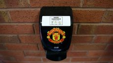 A hand sanitizer dispenser at Manchester United’s Old Trafford stadium