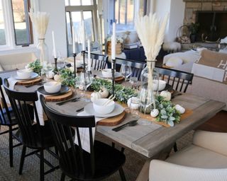 A festive Thanksgiving garland on dining table in open plan living-dining space
