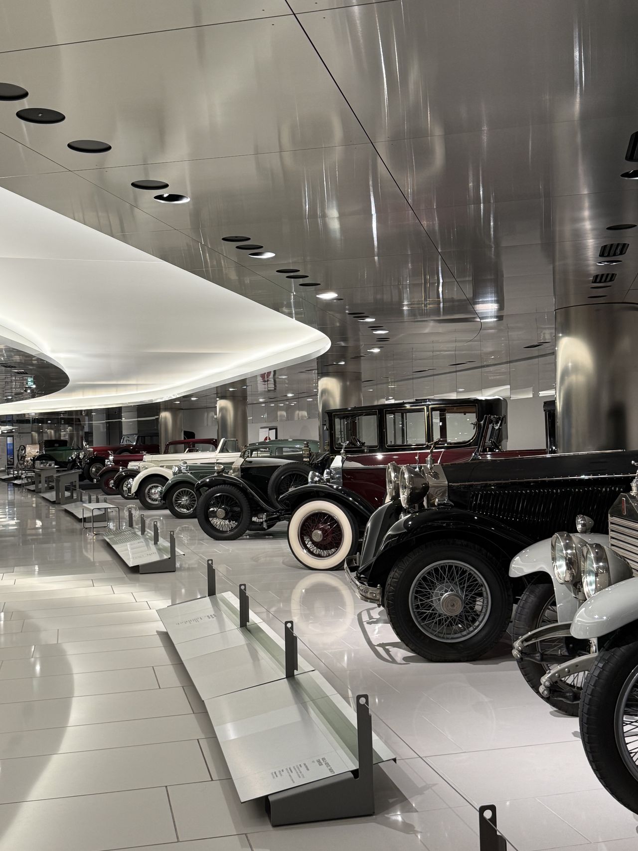 A row of vintage cars in the museum