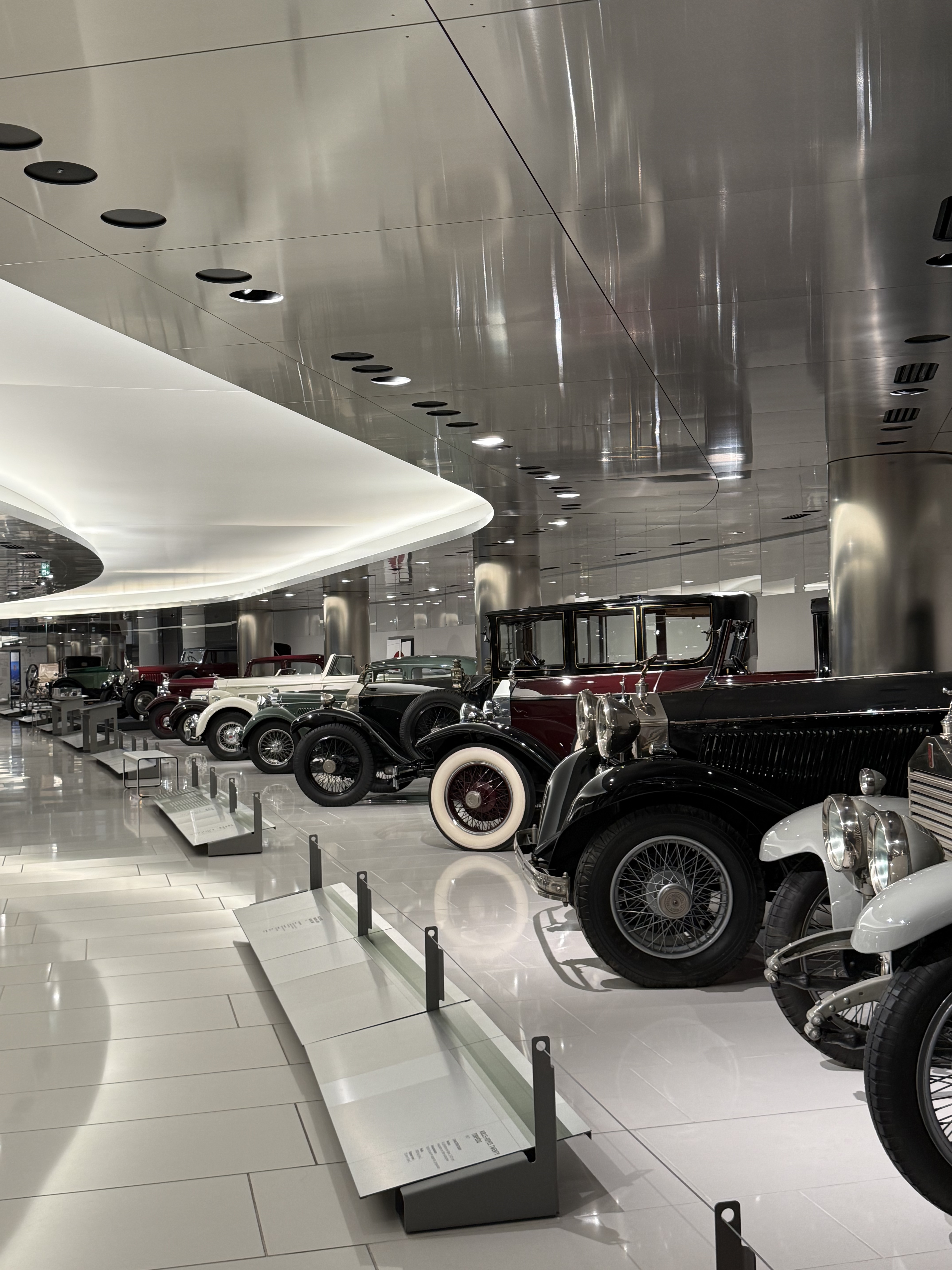 A row of vintage cars in the museum
