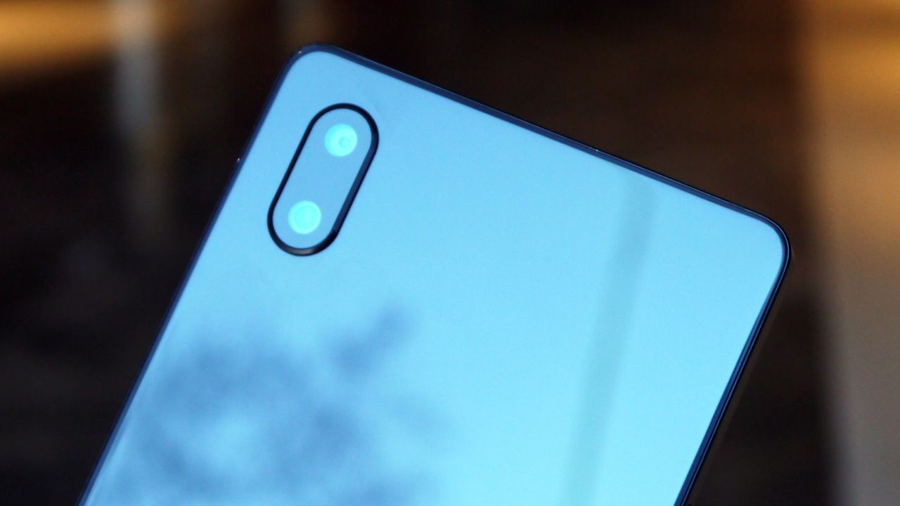 When you exit the app, or switch to the rear camera, it'll lower itself back into the phone