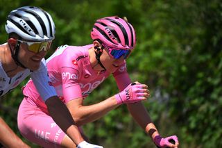 Tadej Pogačar speaking to his teammate Mikkel Bjerg on stage nine of the Giro d'Italia